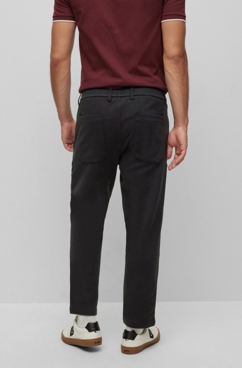 μαύρο παντελόνι Hugo Boss με κωνική εφαρμογή σε δίχρωμο βαμβακερό ζέρσεϊ
