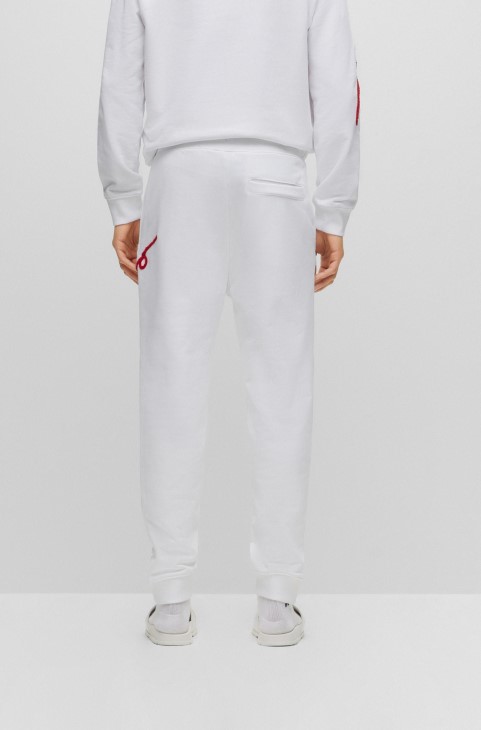 Παντελόνι φόρμας Hugo Boss λευκό βαμβακερό με χειρόγραφο κέντημα με λογότυπο
