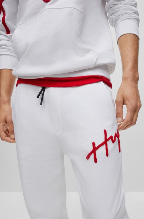 Παντελόνι φόρμας Hugo Boss λευκό βαμβακερό με χειρόγραφο κέντημα με λογότυπο

