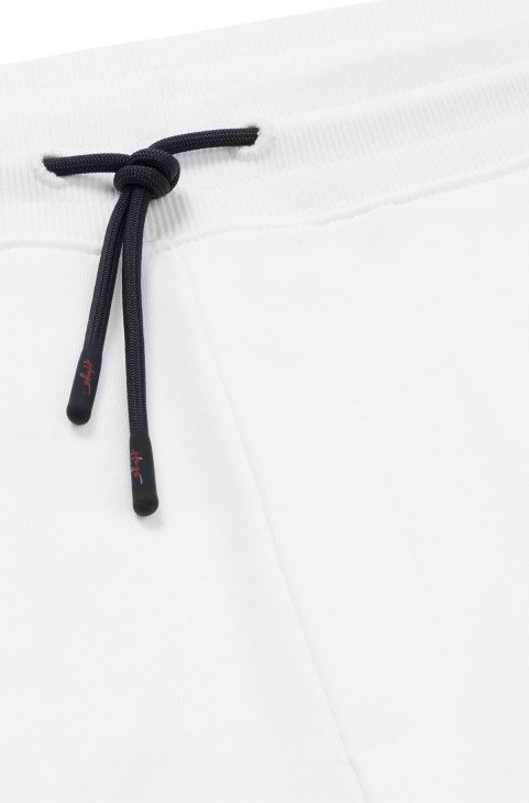 Παντελόνι φόρμας Hugo Boss λευκό βαμβακερό με χειρόγραφο κέντημα με λογότυπο
