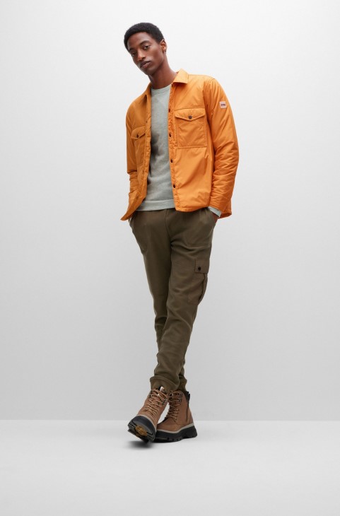 υδατοαπωθητικό μπλουζάκι μεγάλου μεγέθους με λαστιχένιο λογότυπο Hugo Boss ανοιχτό πορτοκαλί
